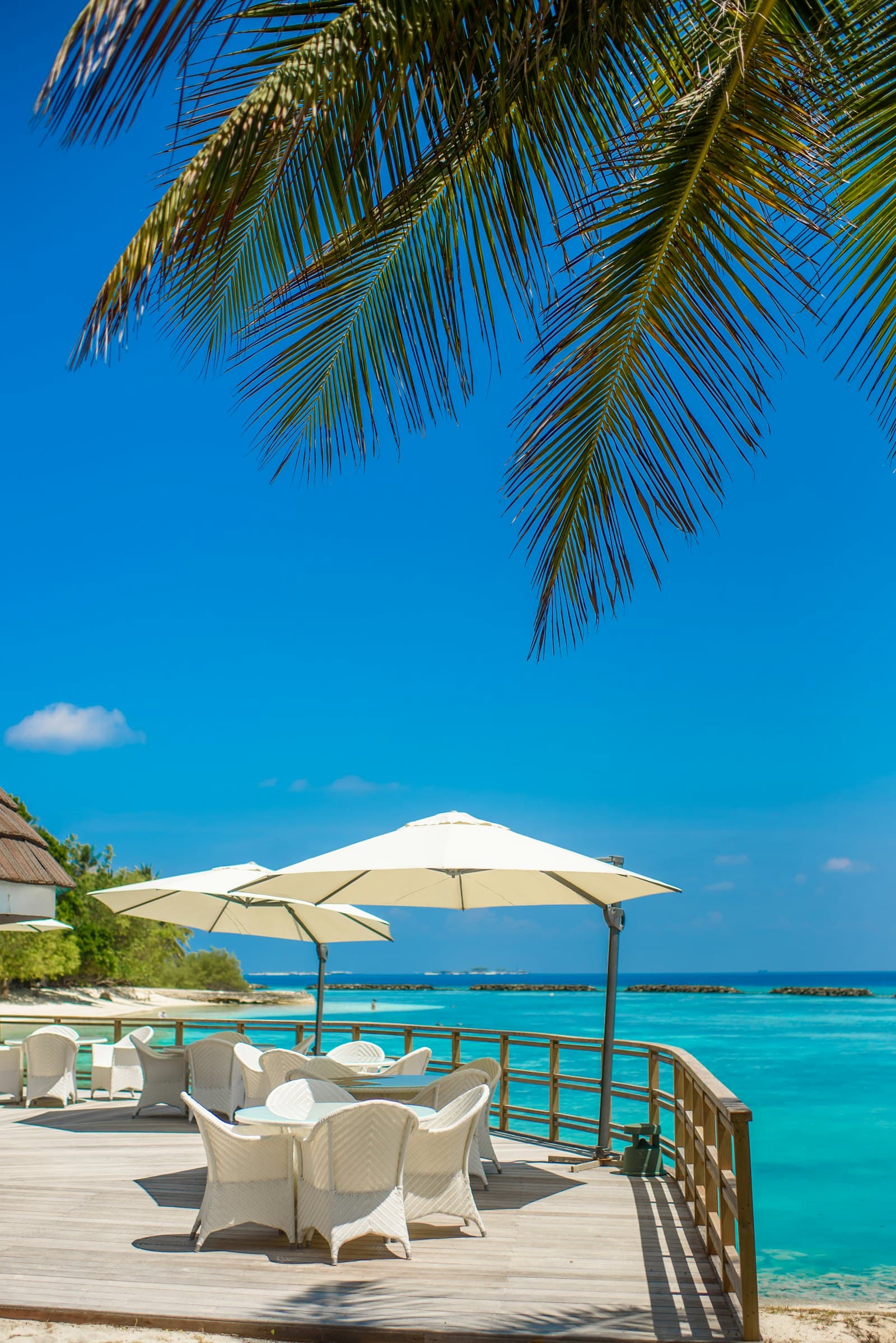 A seaside deck overlooking a turquoise Pacific lagoon